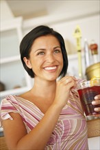 Young woman drinking at bar