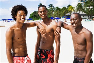 African men smiling on beach