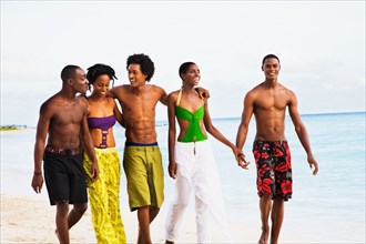 African friends walking on beach