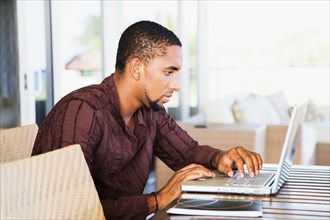 African man using laptop
