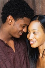 African couple smiling face to face
