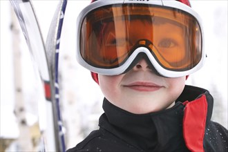 Caucasian boy wearing ski gear in snow