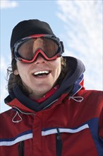 Caucasian man wearing ski goggles