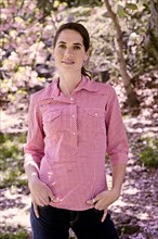 Mixed race woman standing in park