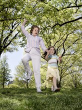 Senior Caucasian woman and granddaughter playing in park