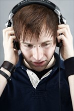 Caucasian man listening to headphones