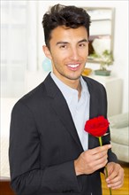 Mixed race teenager holding rose