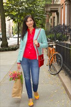 Mixed race woman carry shopping bag