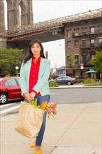 Mixed race woman with shopping bag