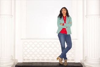 Mixed race woman standing on bench