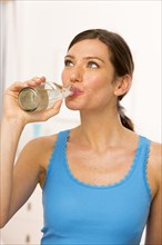 Caucasian woman drinking water