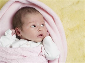 Close up of mixed race newborn baby