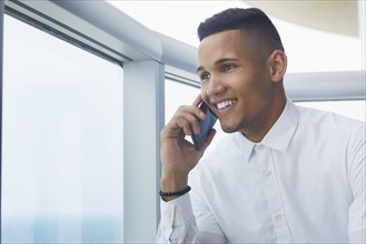 Black businessman talking on cell phone