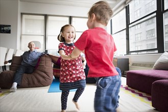 Children dancing in living room