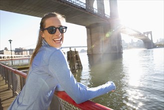 Caucasian woman smiling on waterfront