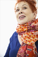Older Caucasian woman wearing colorful scarf