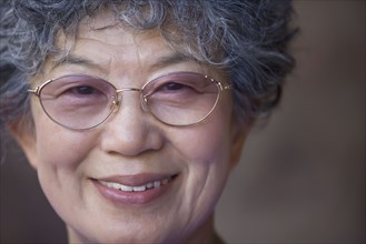 Close up of Japanese woman wearing eyeglasses
