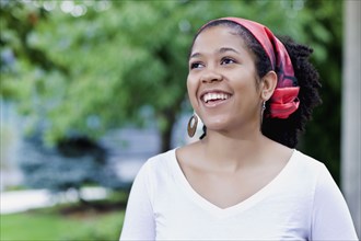 Mixed race woman wearing traditional headscarf