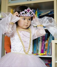 Asian girl dressing up in princess costume