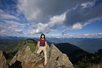 Japanese woman posing on mountain top