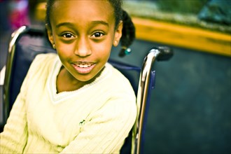 African American girl sitting in wheelchair