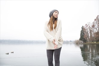 Japanese woman standing near lake