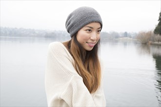 Japanese woman standing near lake