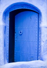 Open blue metal door