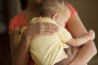 Mother holding sleeping child