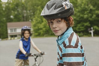 Boys riding bicycles together outdoors