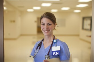 Caucasian nurse smiling in hospital