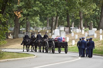 Carriage pulling casket to military cemetery