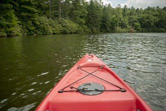 Canoe floating on remote lake