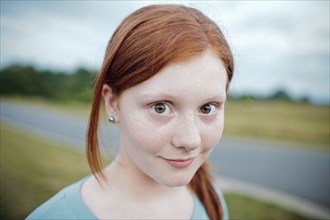 Portrait of Caucasian girl near road