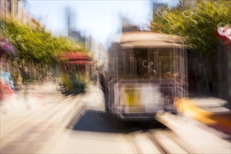 Blurred view of cable cars on tracks