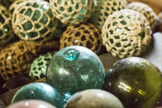 Close up of glass ball decorations with fishing net