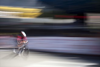 Blurred view of cyclist competing in race