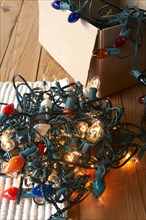 Glowing Christmas lights tangled on floor