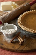 Baking ingredients and homemade pumpkin pie