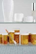 Medicine cabinet with  pill bottles and syringe