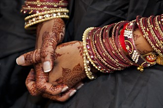 Close up of Indian woman's hands with traditional decoration