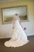 Lebanese bride admiring herself in mirror