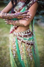 Woman wearing traditional Indian henna and robes