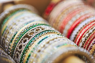 Close up of rows of bangles for sale
