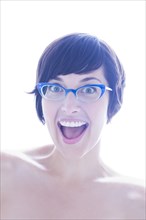 Portrait of surprised woman in eyeglasses