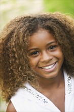 Close up of African American girl smiling