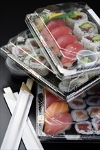 Sushi in takeout containers