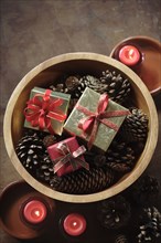 Christmas gifts in wooden bowl