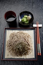 Asian noodles on plate with chopsticks