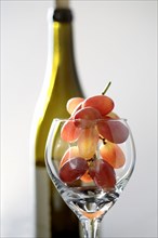 Grapes in wine glass